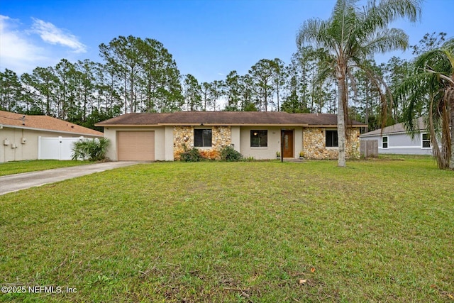 single story home featuring a front lawn and a garage