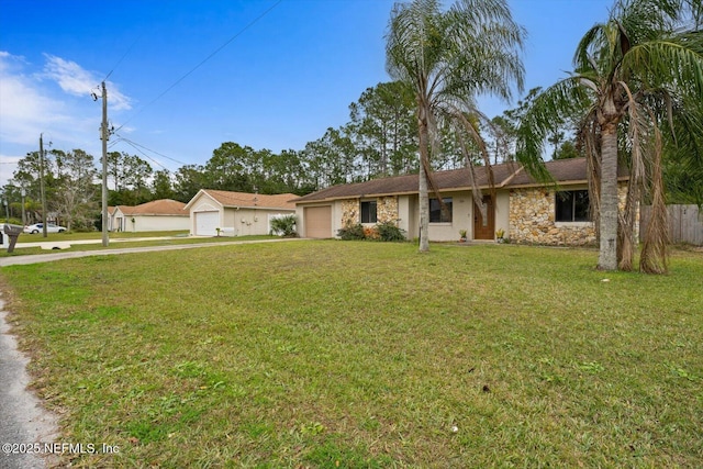 single story home featuring a front yard and a garage