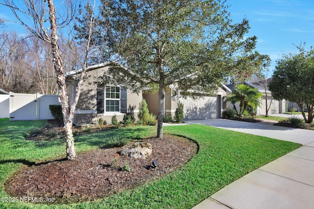 view of front of house featuring a garage and a front lawn