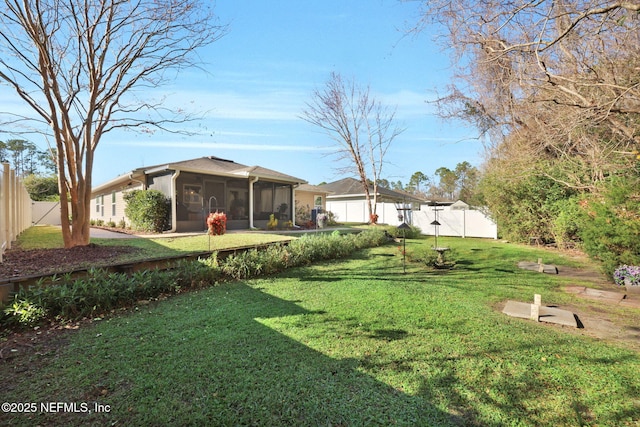 view of yard featuring a sunroom