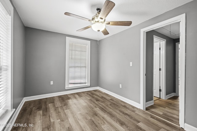 spare room featuring ceiling fan and wood-type flooring