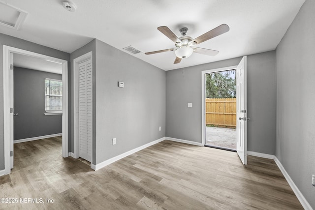 unfurnished room featuring ceiling fan and light wood-type flooring