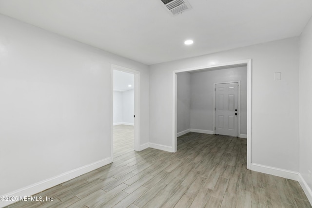 unfurnished room with light hardwood / wood-style flooring