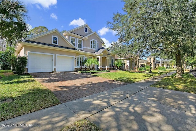 view of front of property with a garage and a front yard