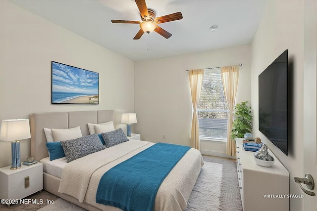 bedroom with light colored carpet and ceiling fan