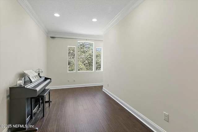 misc room featuring crown molding, dark hardwood / wood-style floors, and a textured ceiling