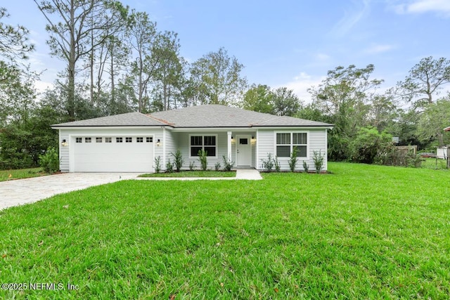 ranch-style house featuring a garage and a front lawn