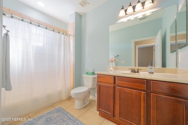 bathroom featuring tile patterned floors, vanity, curtained shower, and toilet