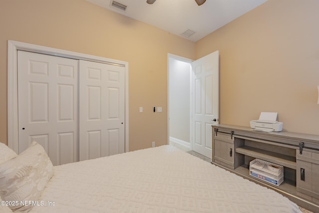 bedroom with ceiling fan and a closet