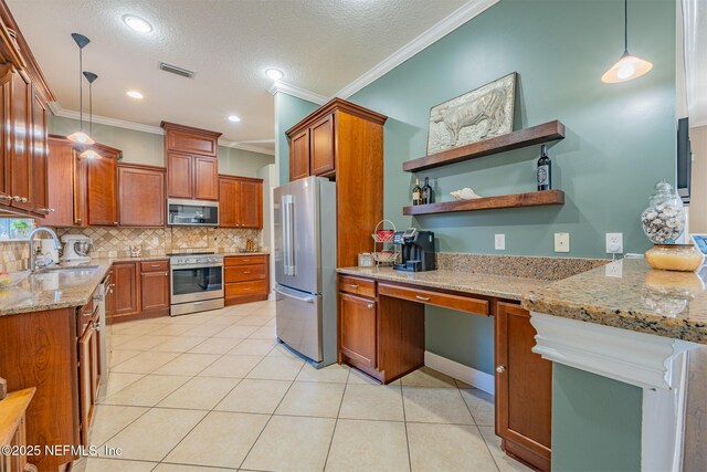 kitchen with appliances with stainless steel finishes, hanging light fixtures, crown molding, and sink