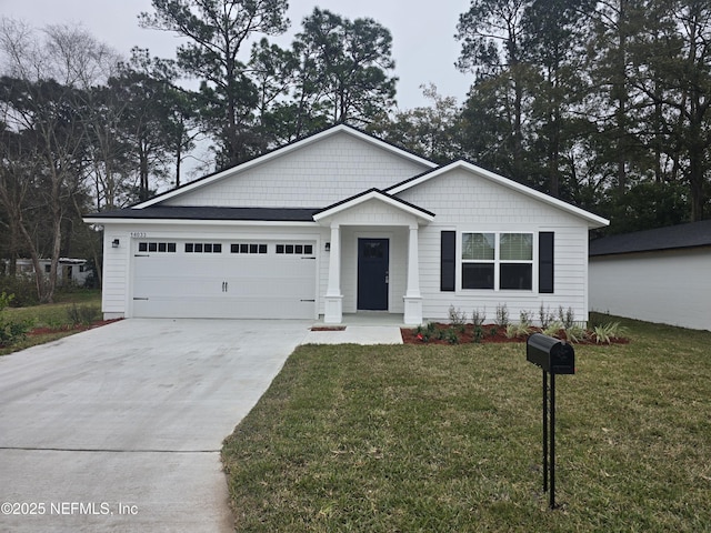 view of front facade with a front yard and a garage