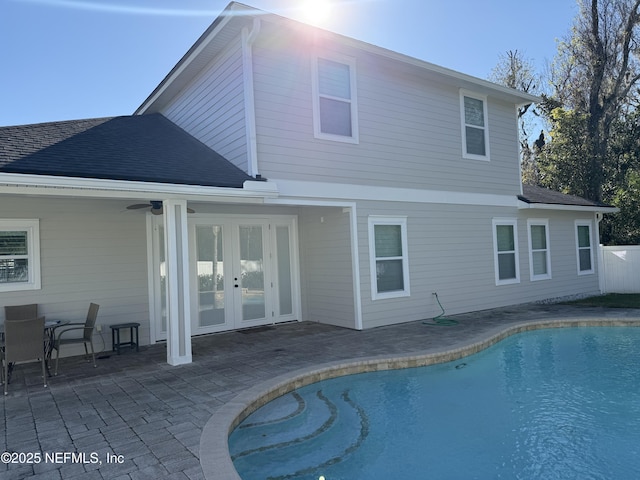 rear view of property with ceiling fan, a patio, and french doors