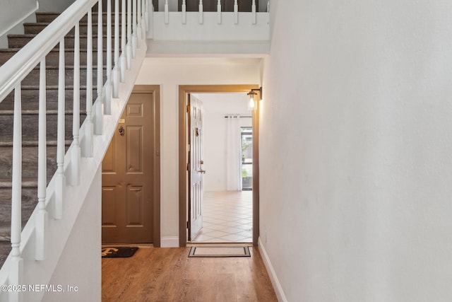 stairway featuring wood-type flooring