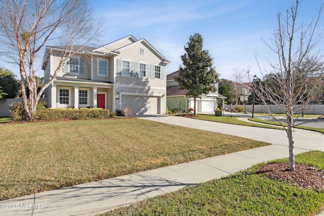 view of front of house with a front lawn and a garage