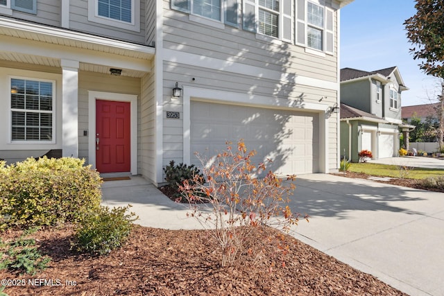 view of exterior entry featuring a garage