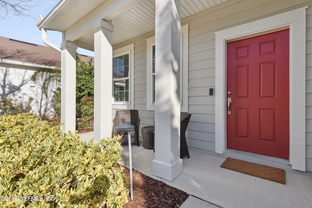 doorway to property with covered porch