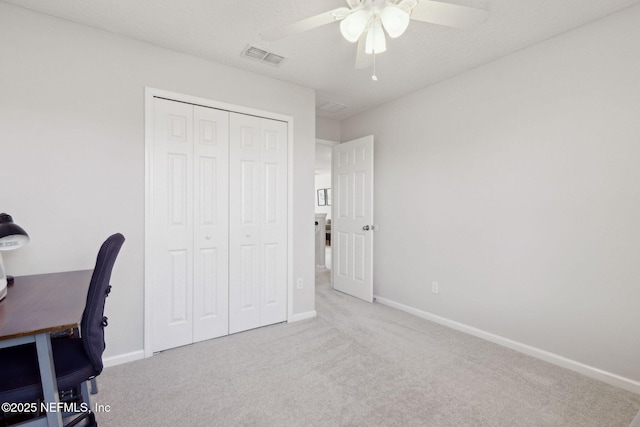 office area with light colored carpet and ceiling fan