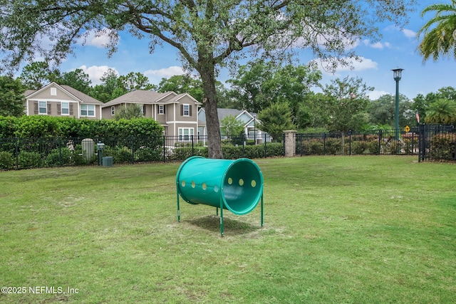 view of home's community with a yard