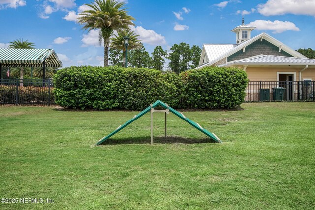 view of home's community with a lawn