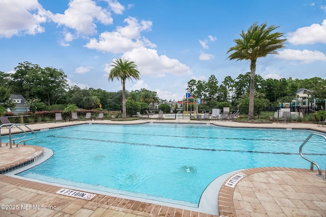 view of swimming pool featuring a patio area