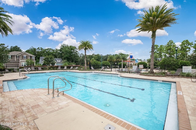 view of swimming pool featuring a patio area