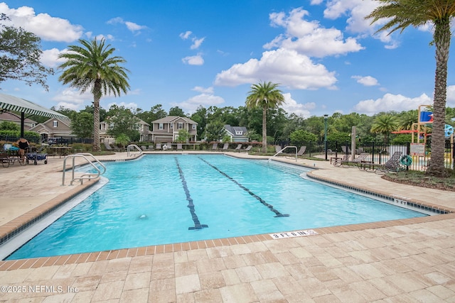 view of swimming pool with a patio area