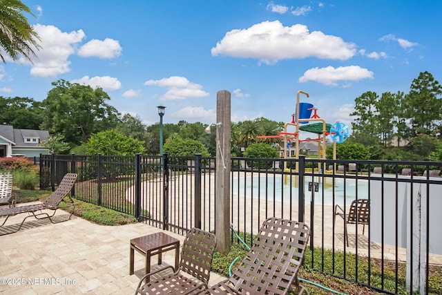 view of patio featuring a swimming pool