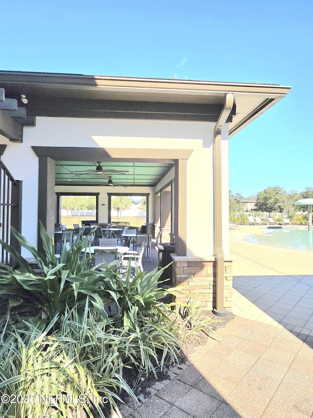 view of patio / terrace featuring ceiling fan