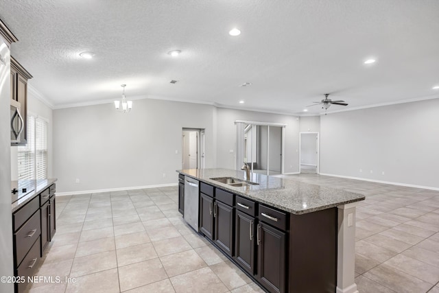 kitchen with sink, stainless steel dishwasher, crown molding, a kitchen island with sink, and ceiling fan with notable chandelier