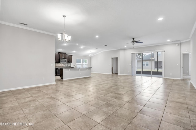 unfurnished living room featuring light tile patterned floors, ceiling fan with notable chandelier, crown molding, and sink