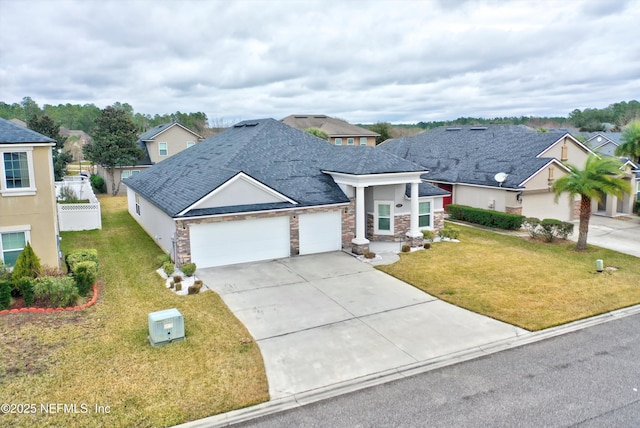 view of front facade featuring a garage and a front lawn