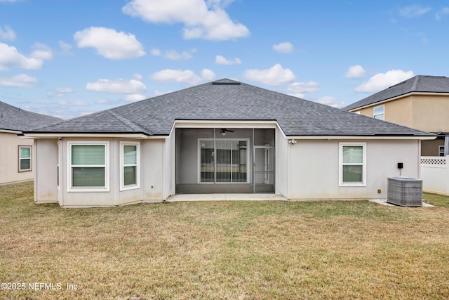 back of property featuring a yard, central AC, and a sunroom