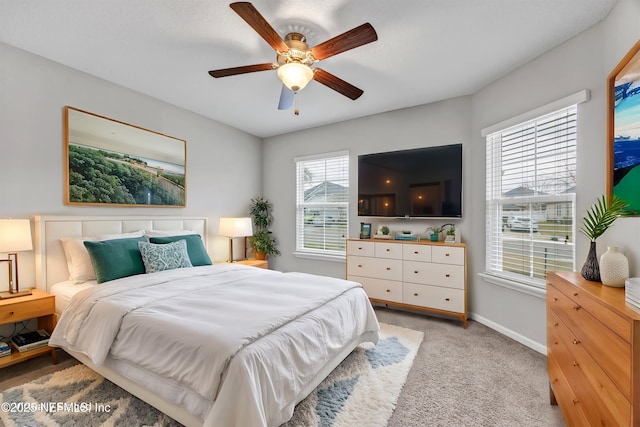 bedroom featuring ceiling fan and light colored carpet