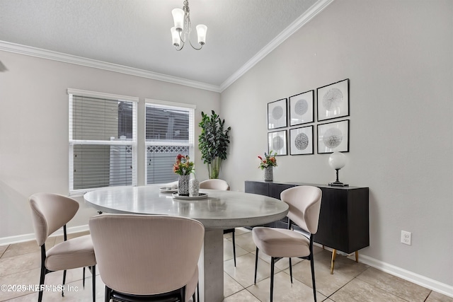 dining space featuring a notable chandelier, ornamental molding, a textured ceiling, and light tile patterned floors