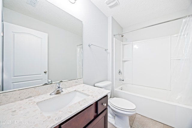 full bathroom featuring tile patterned flooring, a textured ceiling, toilet, shower / tub combo with curtain, and vanity