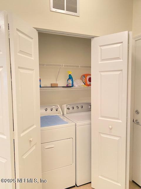 laundry area featuring washer and clothes dryer