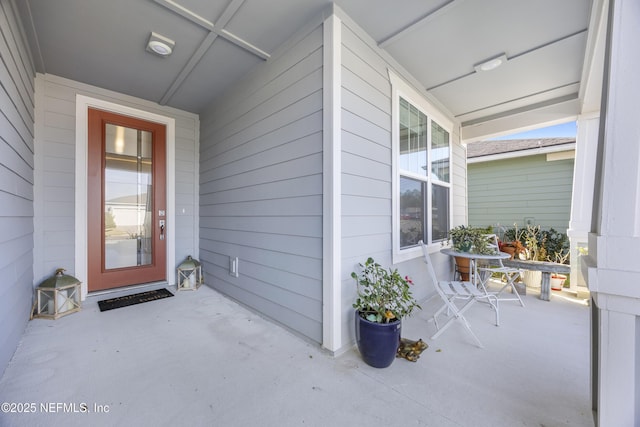 doorway to property featuring a porch