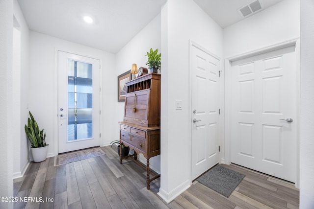 entrance foyer with hardwood / wood-style floors