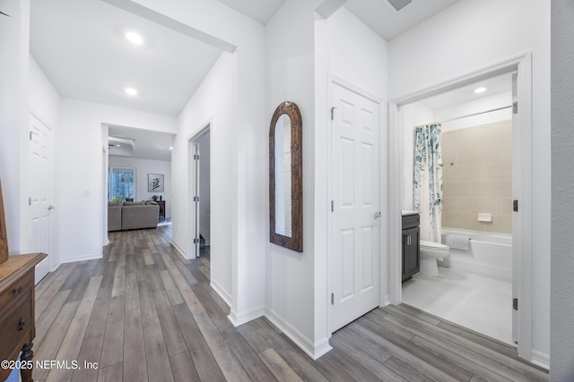 hallway with light wood-type flooring