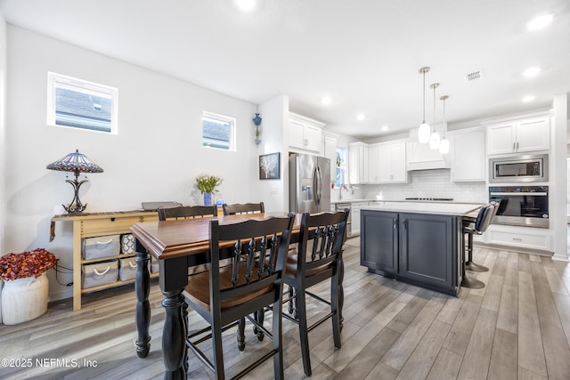 dining room with light wood-type flooring