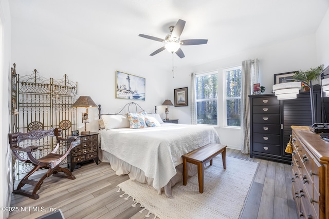 bedroom featuring hardwood / wood-style flooring and ceiling fan