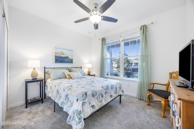 carpeted bedroom featuring ceiling fan