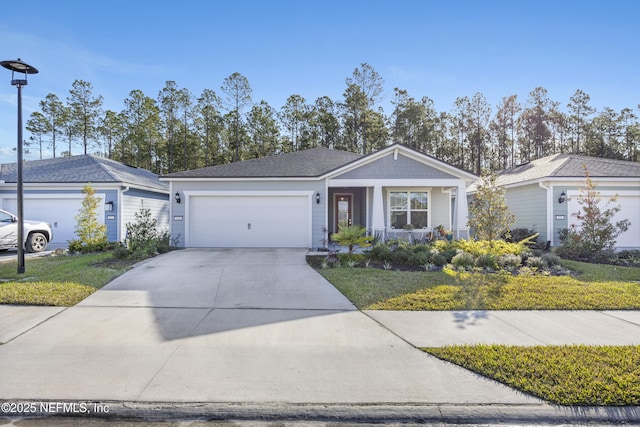 ranch-style home featuring a garage and a front lawn