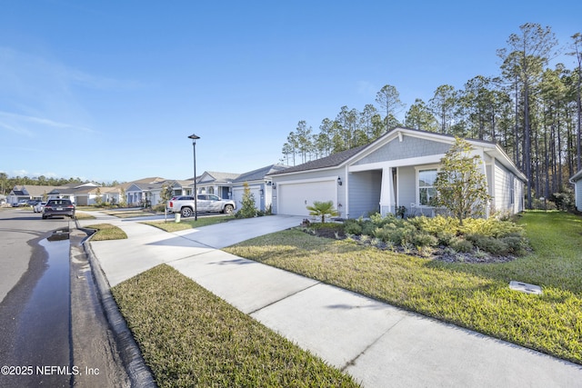 view of front facade featuring a garage and a front lawn