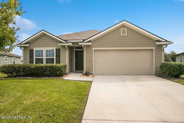 ranch-style house featuring a front yard and a garage