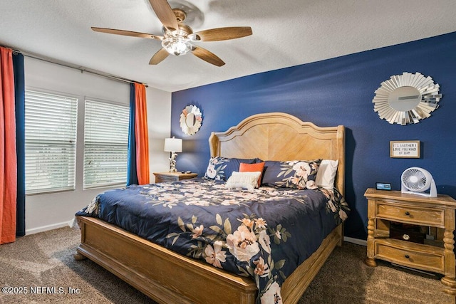 carpeted bedroom with a textured ceiling and ceiling fan