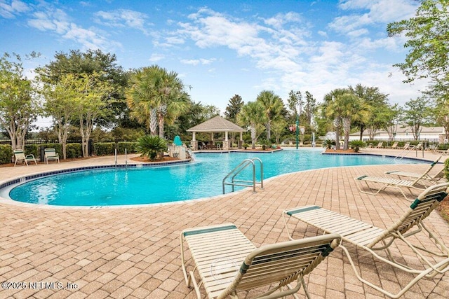 view of swimming pool featuring a gazebo and a patio area