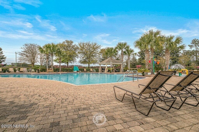 view of swimming pool featuring a patio