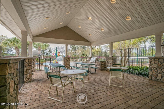 view of patio featuring area for grilling and a grill