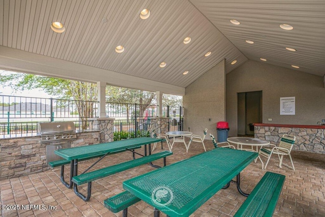 game room featuring vaulted ceiling